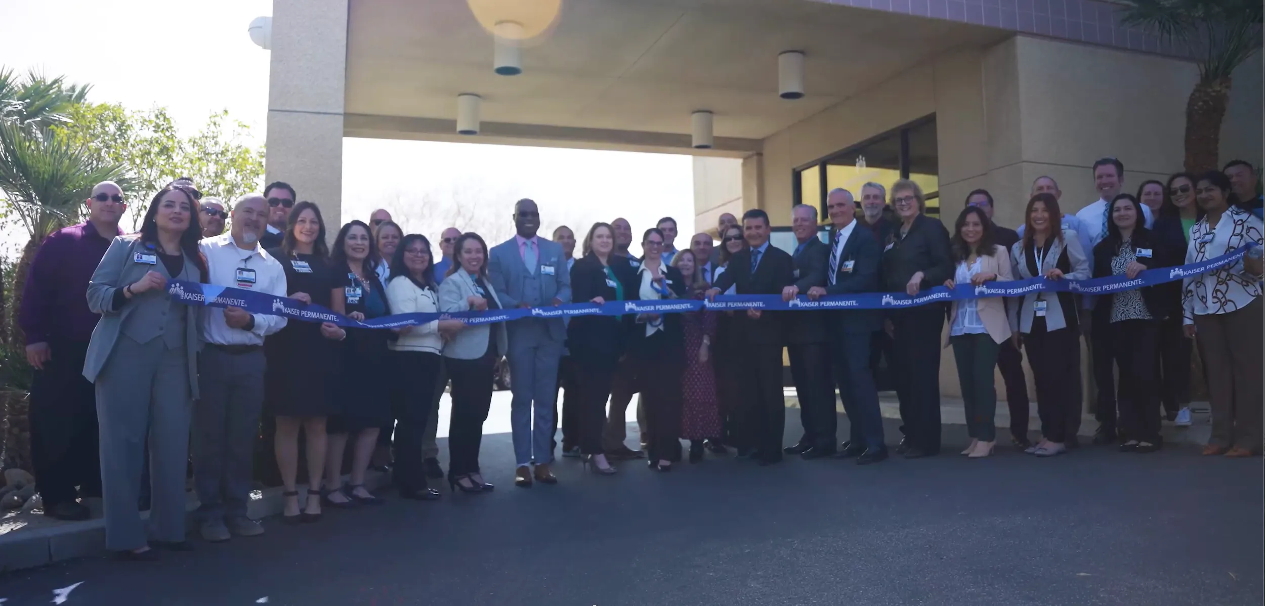Staff and guests line up for a ribbon cutting at Valley Surgery Center.